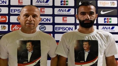 مدرب سوريا يدعم الأسد بقميص يحمل صورته