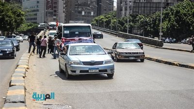 مسيرة بالسيارات أعلى كوبري الدقي احتفالًا بذكرى 