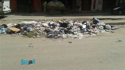 بالصور.. مواطن انتشار القمامة أمام المدارس ببولاق الدكرور 