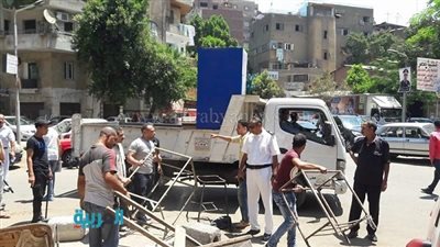 بالصور.. إزالة إشغالات الباعة الجائلين بشوارع الدقي 