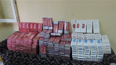 ضبط 4 آلاف علبة سجائر و183 كارت شحن قبل بيعهم بالسوق السوداء بالجيزة