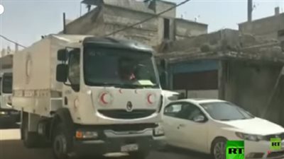 بالفيديو.. دخول قافلة مساعدات إنسانية إلى الغوطة الشرقية عبر معبر الوافدين