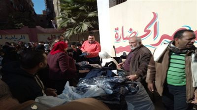 حب الوطن بالجيزة يوزيع ملابس الشتاء على طلاب مدارس بولاق