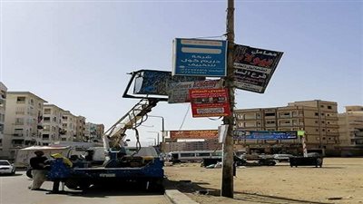  إزالة الإعلانات العشوائية وغير المرخصة بشوارع السويس