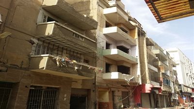 ازالة عقارين بحي السويس ورصف الشوارع المحيطة باستاد الجيش