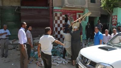 بالصور.. حملات رفع الإشغالات وإزالة التعديات على الأرصفة بالفيوم